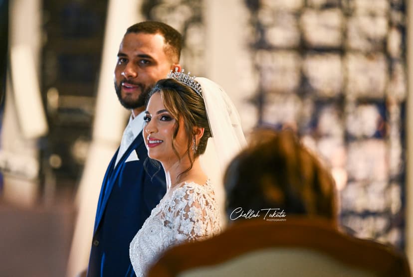 Beautiful couple portrait during ceremony - groom in navy suit, bride in lace gown with tiara