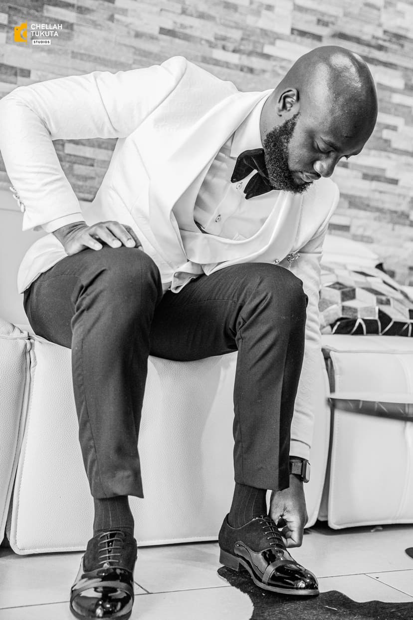 Groom preparation in black and white