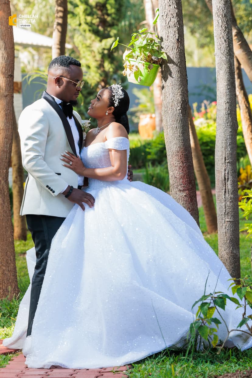 Romantic couple portrait among trees in natural lighting