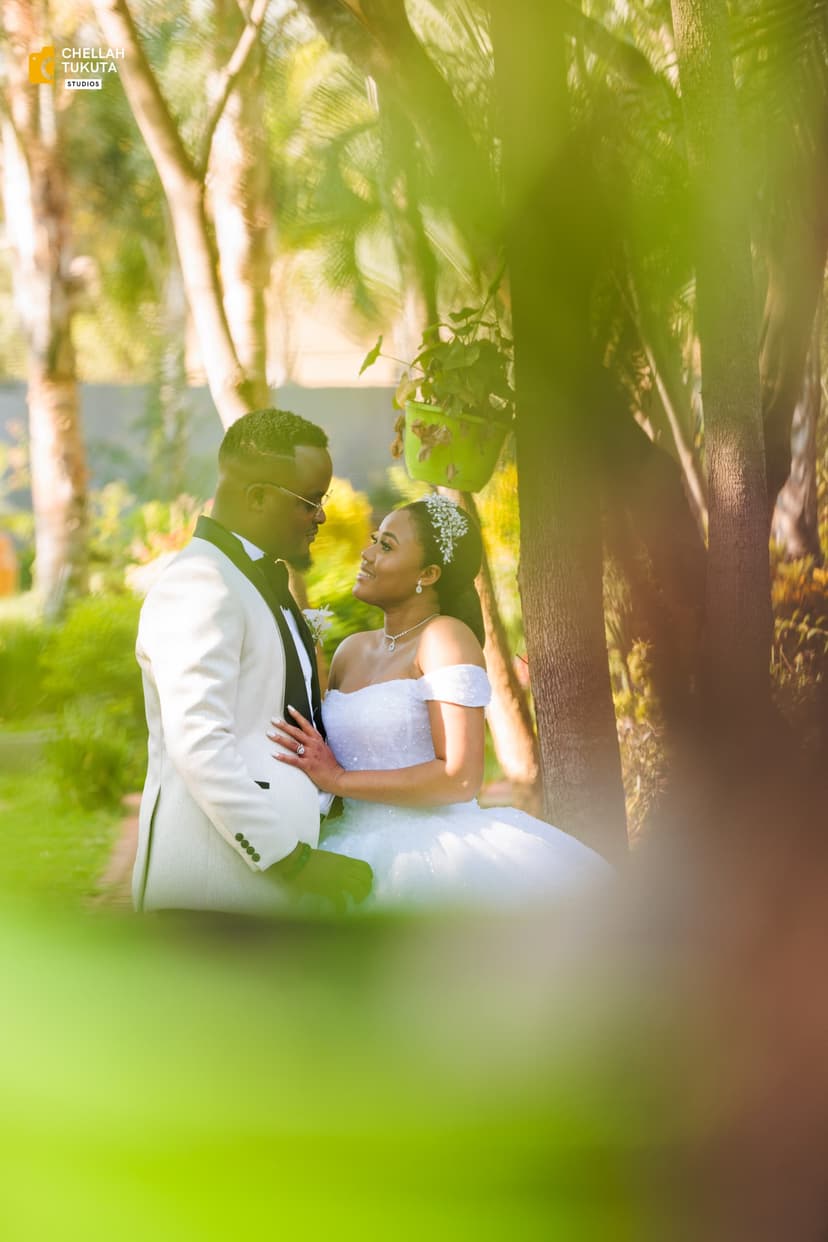 Dreamy couple portrait with natural foliage framing
