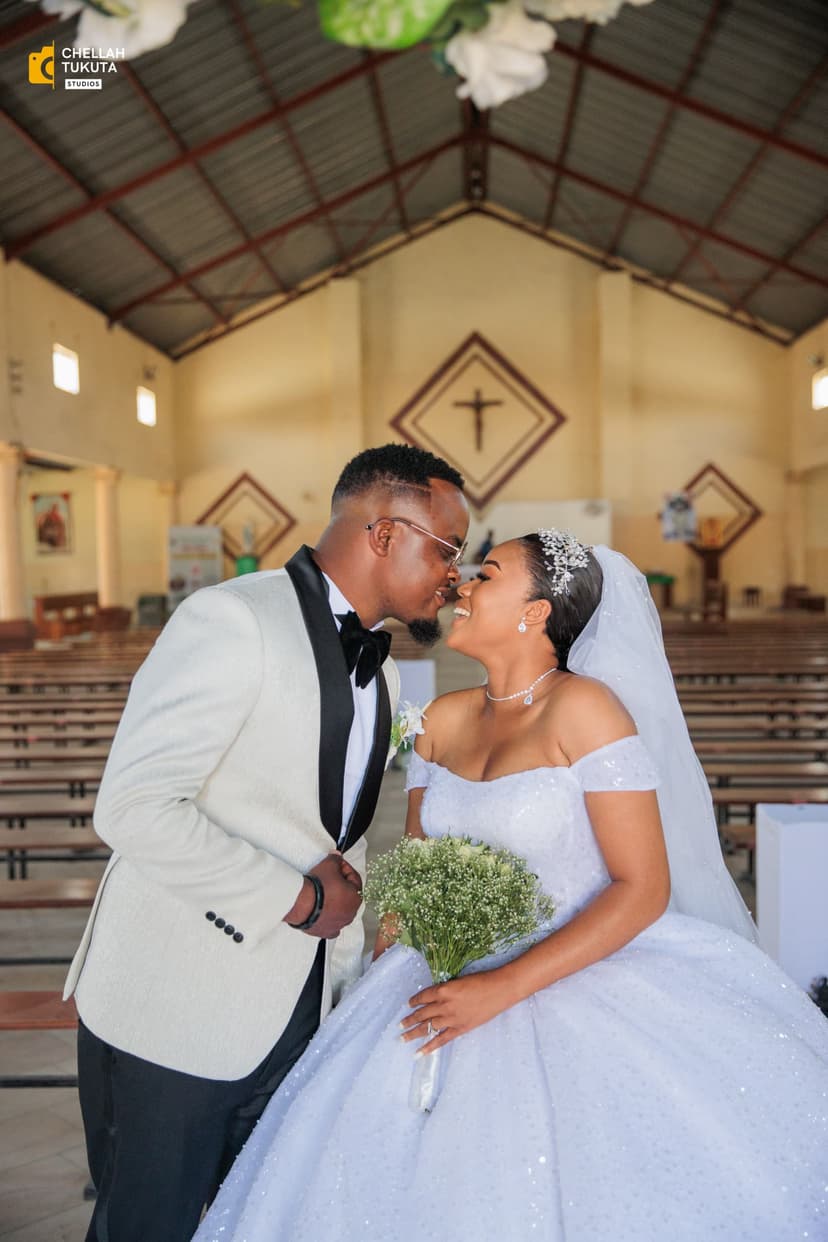 Intimate couple moment during church wedding ceremony