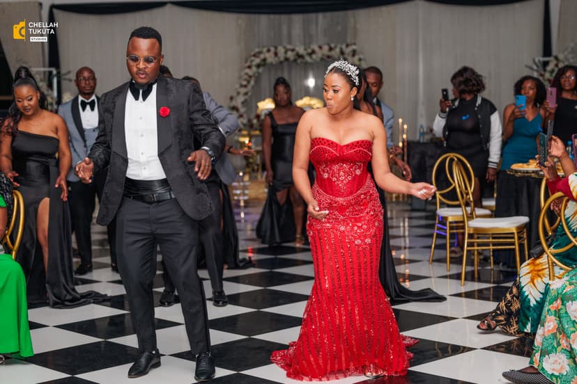 Reception dancing moment with couple in elegant evening attire